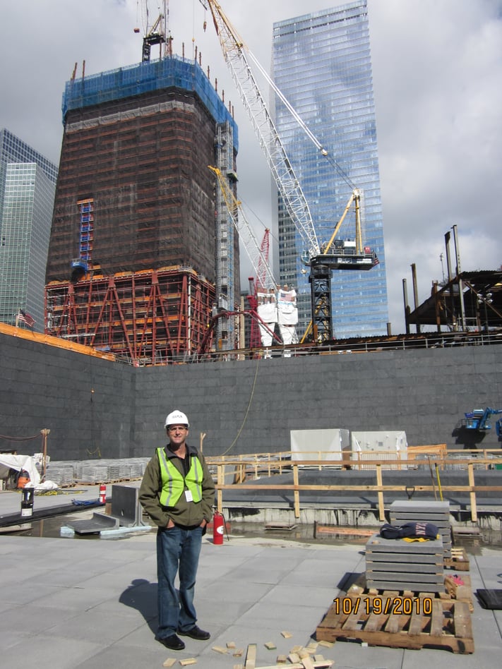 Marc_Inside_WTC_Memorial_Fountain_-_Tower_1_and_7_in_Background.jpg